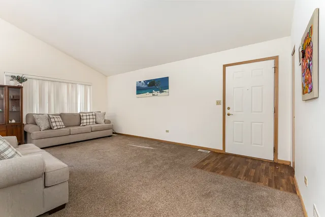 a living room with furniture and a couch
