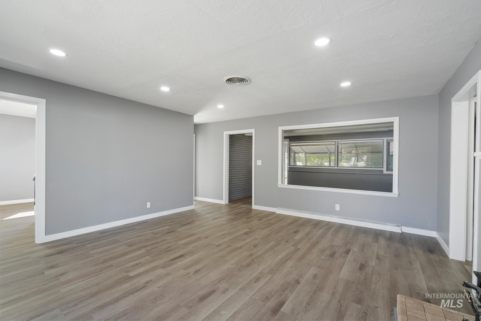 716 West Linden Street Boise, ID 83706 - Photo 11 of 47 Unfurnished living room with light wood-style flooring and recessed lighting
