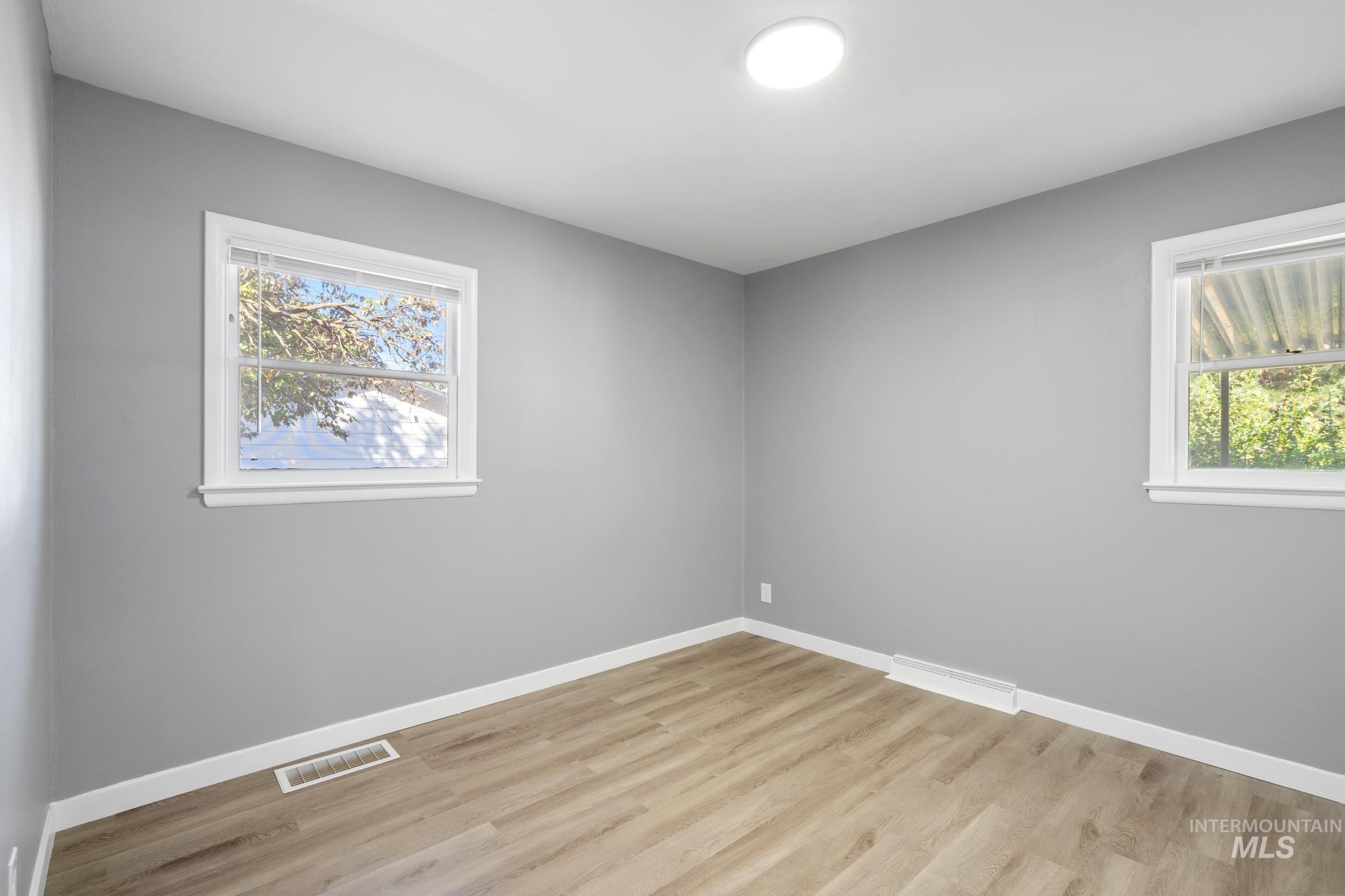 716 West Linden Street Boise, ID 83706 - Photo 20 of 47 Spare room featuring light wood-style flooring and healthy amount of natural light