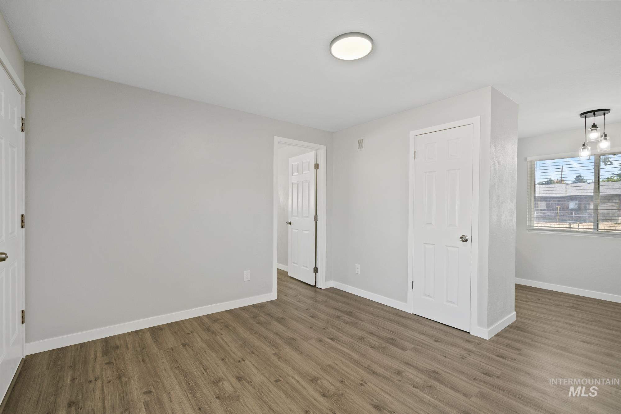 716 West Linden Street Boise, ID 83706 - Photo 29 of 47 Unfurnished bedroom featuring wood finished floors and a closet