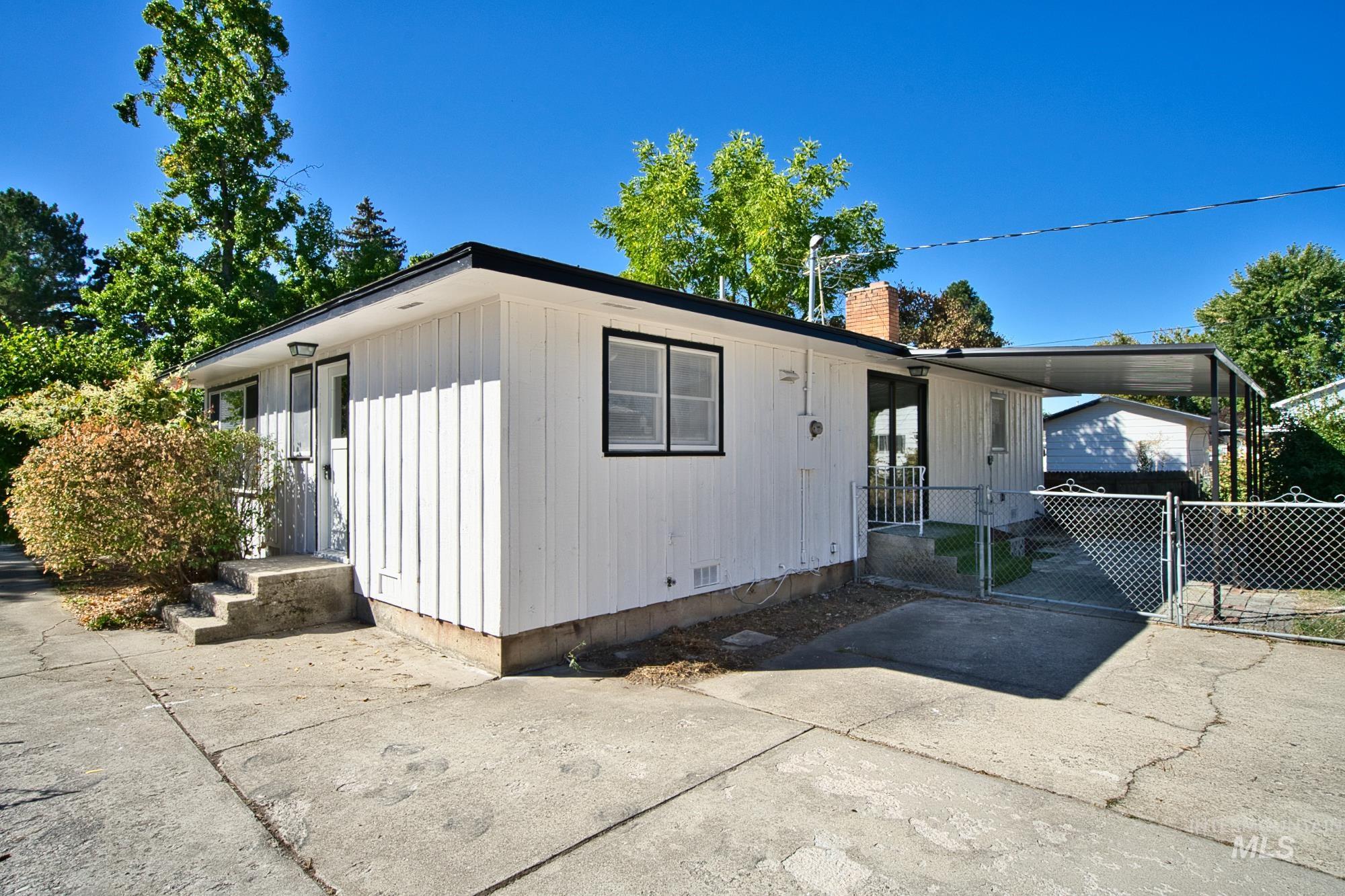 716 West Linden Street Boise, ID 83706 - Photo 44 of 47 View of front of property with a gate, a chimney, and driveway