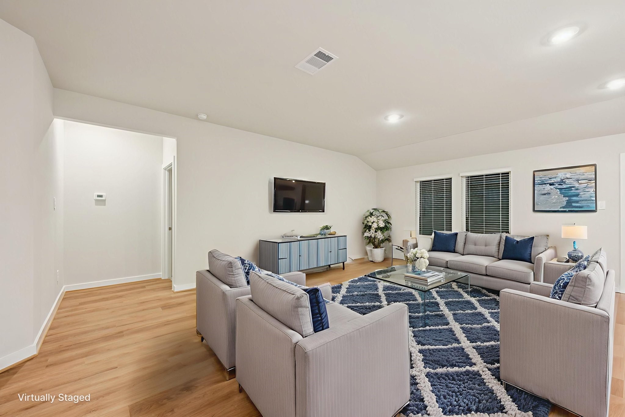 1637 Hopson Ranch Drive Conroe, TX 77301 - Photo 16 of 39 a living room with furniture and a flat screen tv
