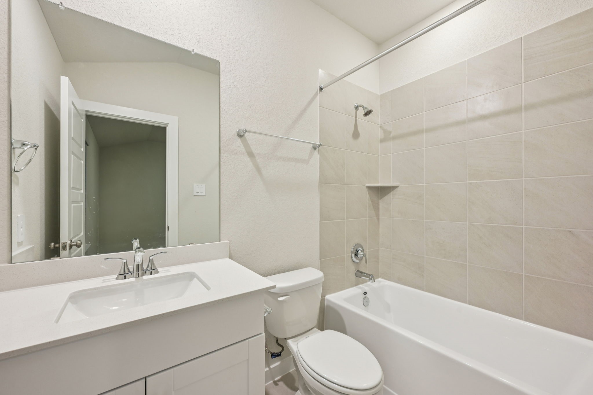 1637 Hopson Ranch Drive Conroe, TX 77301 - Photo 22 of 39 a bathroom with a granite countertop sink toilet and bathtub