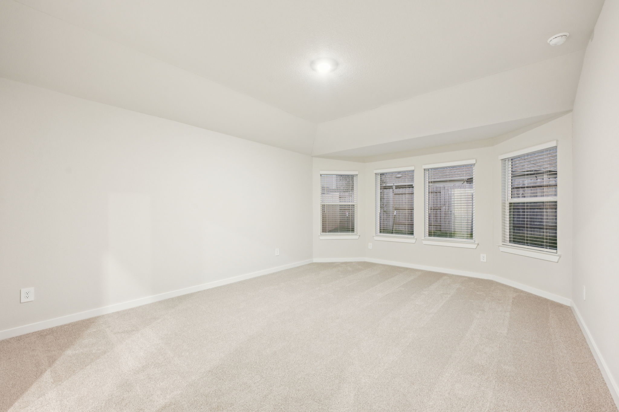 1637 Hopson Ranch Drive Conroe, TX 77301 - Photo 24 of 39 an empty room with windows