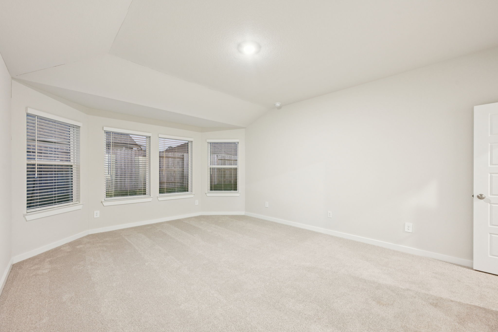 1637 Hopson Ranch Drive Conroe, TX 77301 - Photo 27 of 39 an empty room with windows