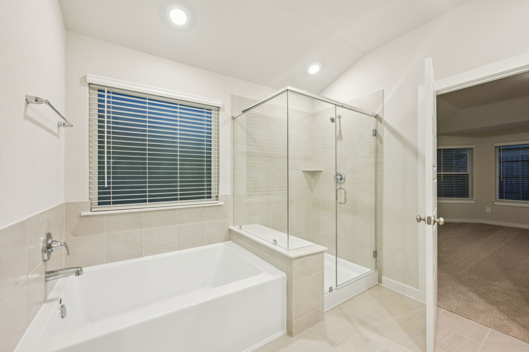 1637 Hopson Ranch Drive Conroe, TX 77301 - Photo 28 of 39 a bathroom with a bathtub and a shower
