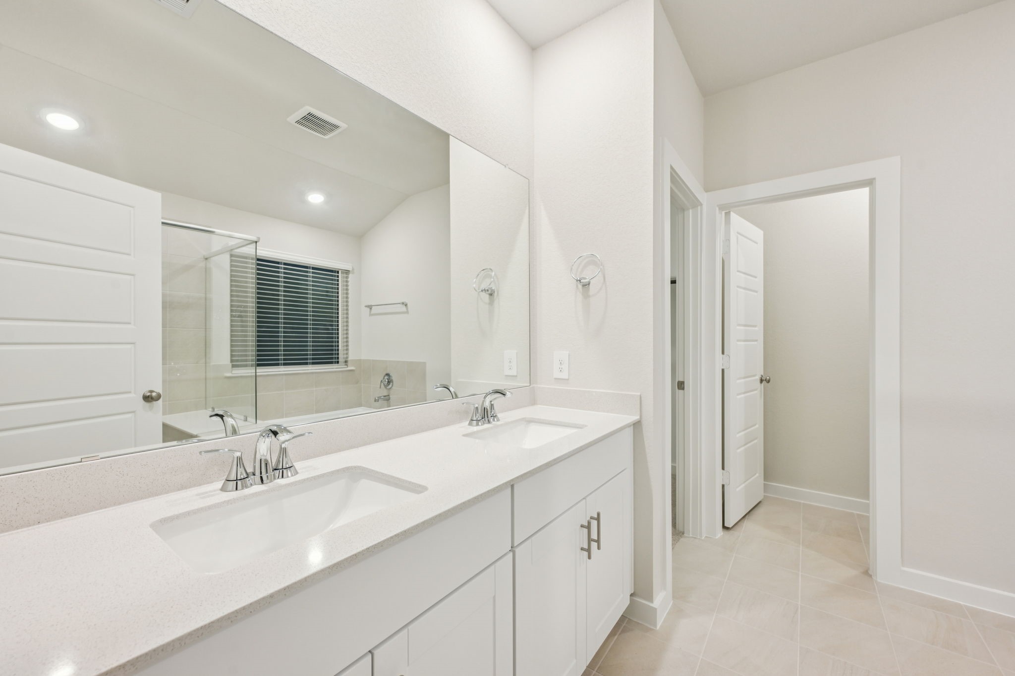 1637 Hopson Ranch Drive Conroe, TX 77301 - Photo 30 of 39 a bathroom with a double vanity sink mirror and double
