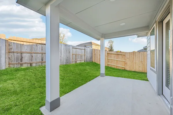 a view of a road with a big yard