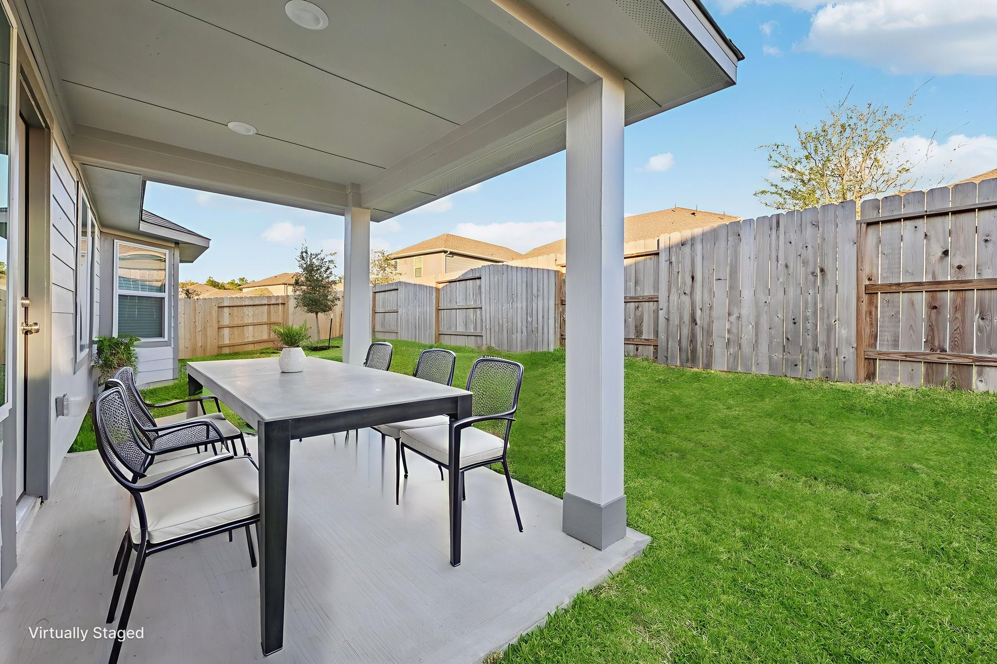 1637 Hopson Ranch Drive Conroe, TX 77301 - Photo 33 of 39 a view of a patio with a table chairs and a backyard