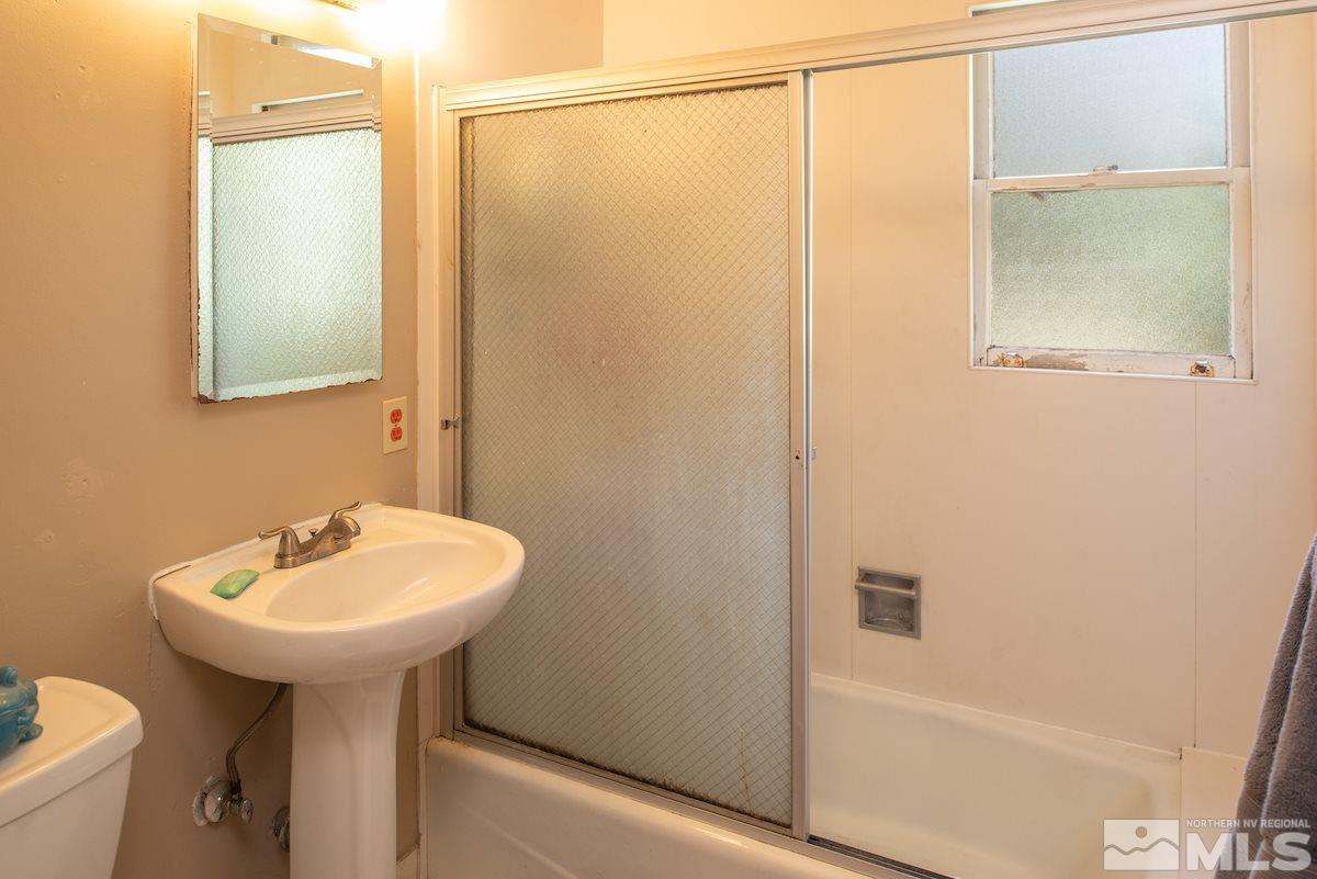 105 Bisby Street Reno, NV 89512 - Photo 12 of 17 a bathroom with a sink and a mirror