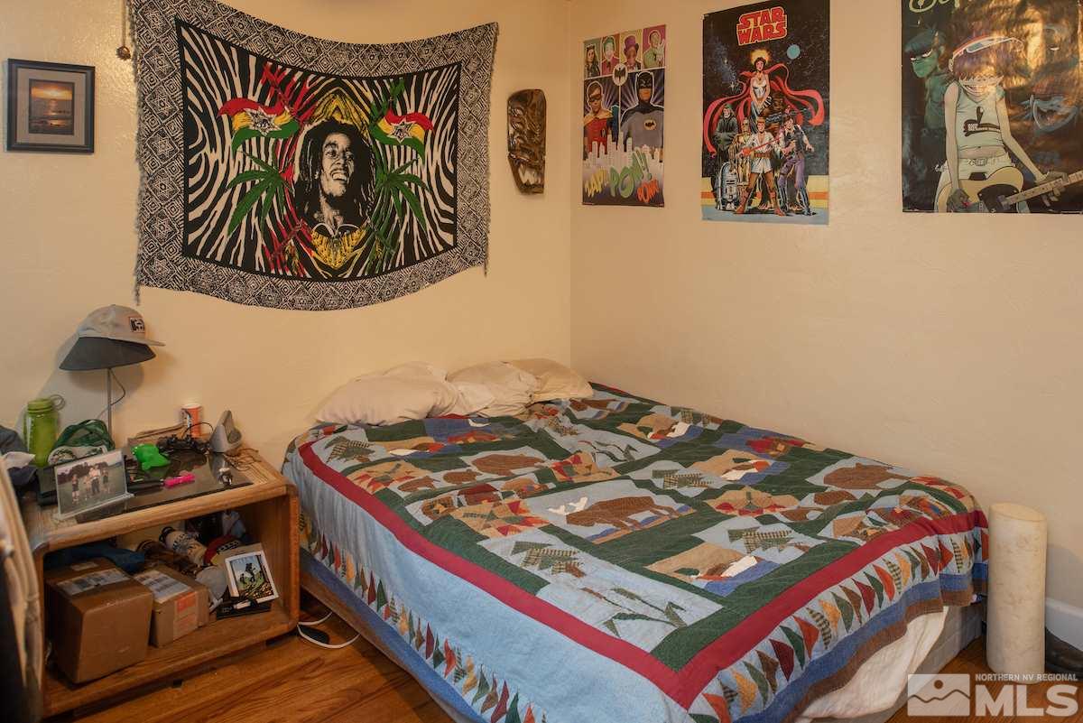 105 Bisby Street Reno, NV 89512 - Photo 15 of 17 a bedroom with a bed and painting on the wall