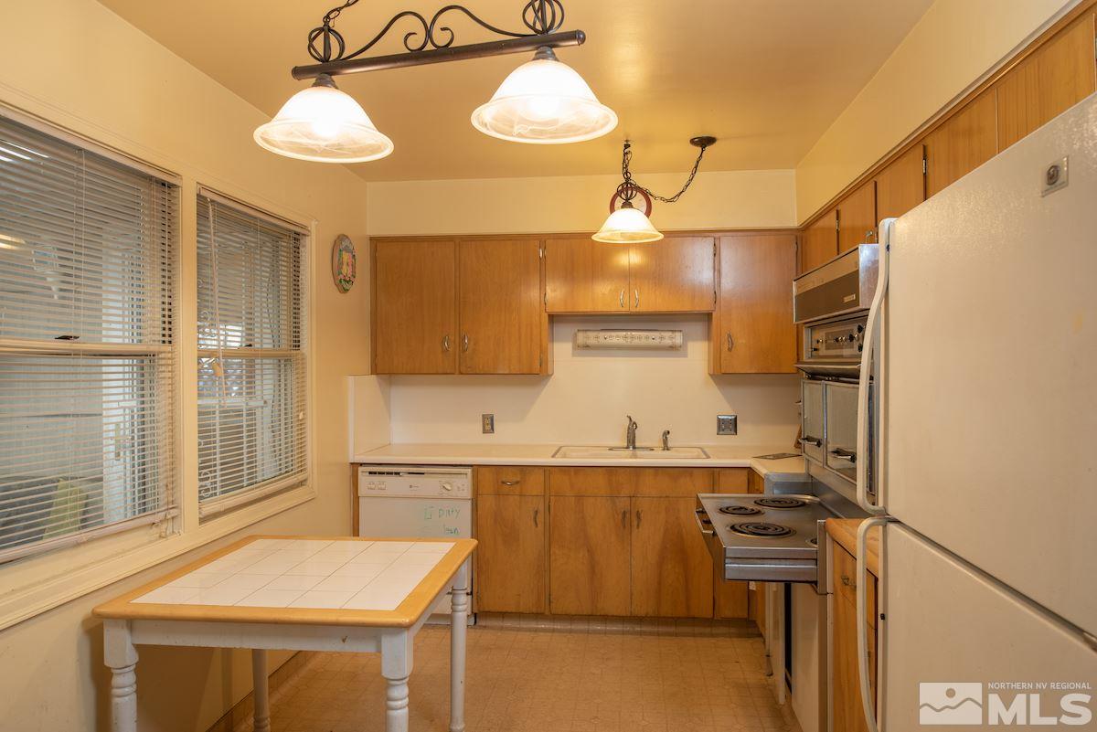 105 Bisby Street Reno, NV 89512 - Photo 8 of 17 a kitchen with a sink appliances and cabinets