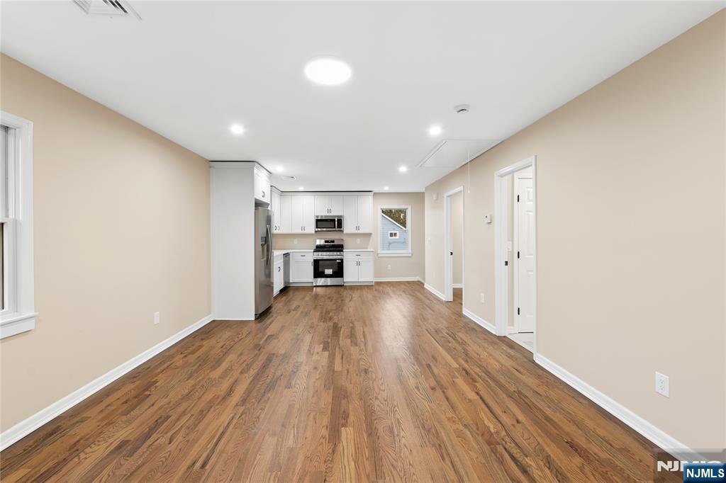 937 Ringwood Avenue, Unit 2 Wanaque, NJ 07420 - Photo 3 of 11 a view of empty room with wooden floor