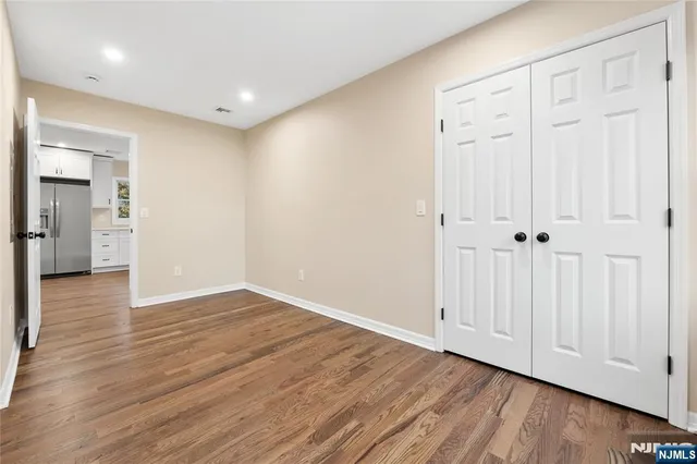 a view of wooden floor in an empty room