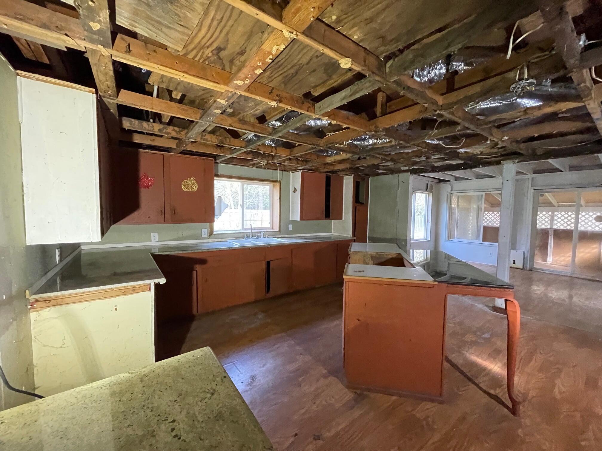 411 South Old Stage Road Cave Junction, OR 97523 - Photo 11 of 39 a view of a kitchen with a sink and a dishwasher