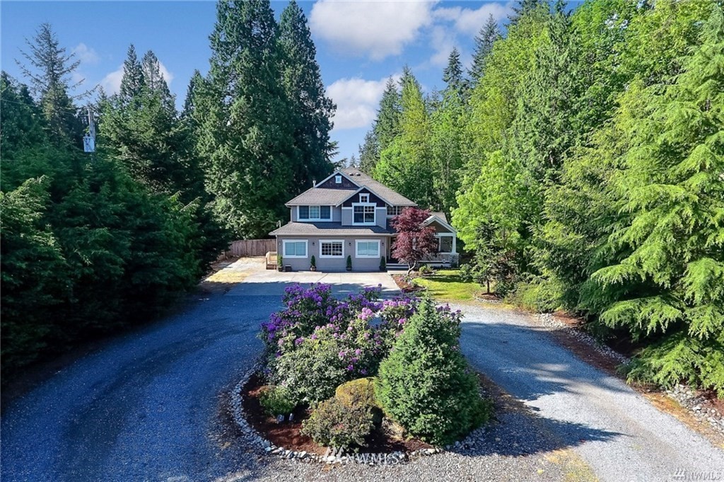4706 224th Street Southeast Bothell, WA 98021 - Photo 1 of 38 a front view of a house with a yard