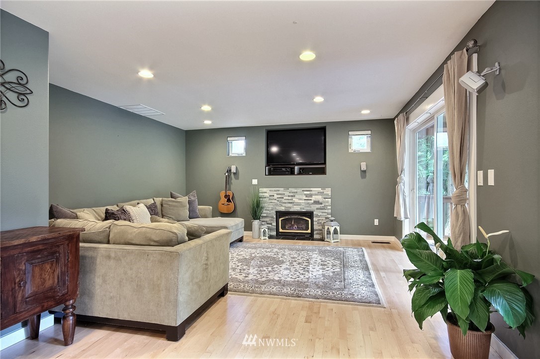 4706 224th Street Southeast Bothell, WA 98021 - Photo 12 of 38 a living room with furniture fireplace and potted plant