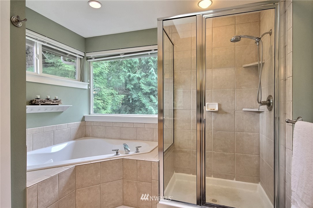 4706 224th Street Southeast Bothell, WA 98021 - Photo 17 of 38 a bathroom with a bathtub and a shower