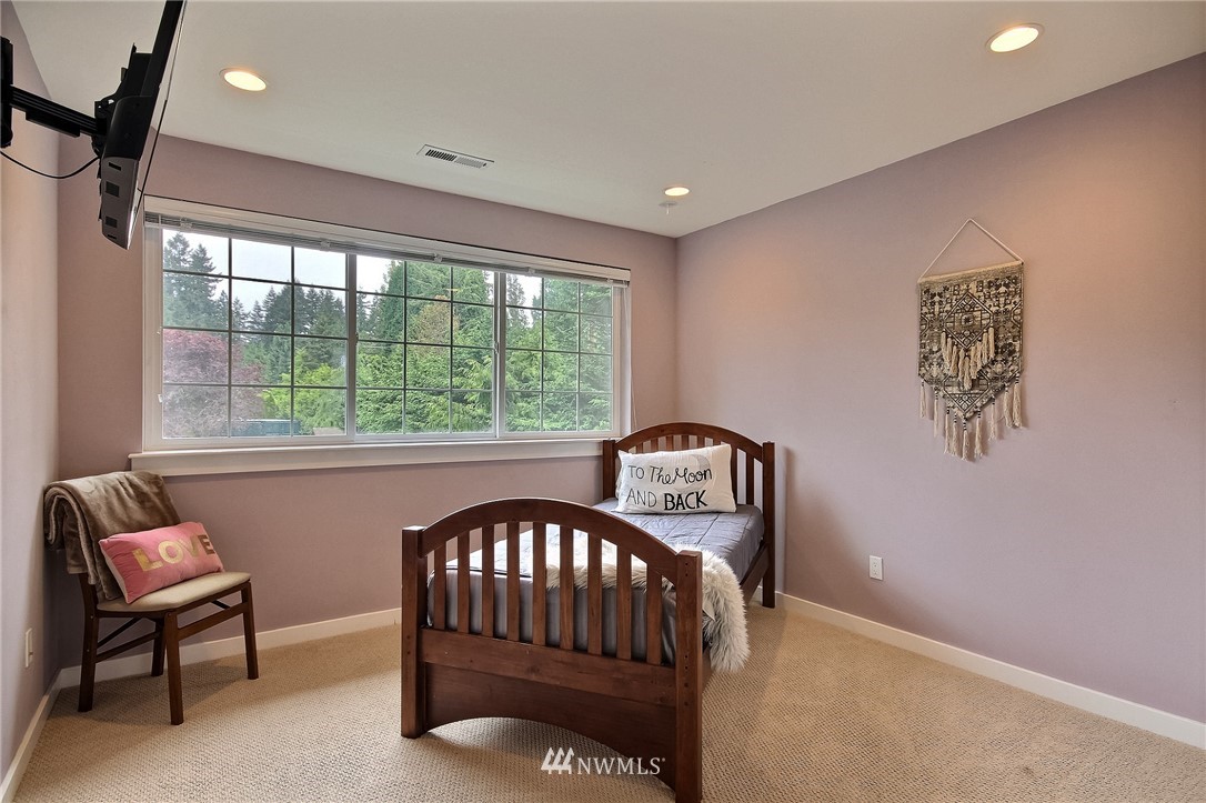 4706 224th Street Southeast Bothell, WA 98021 - Photo 20 of 38 a bedroom with furniture and a window