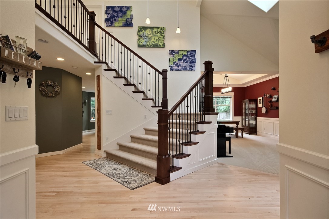4706 224th Street Southeast Bothell, WA 98021 - Photo 3 of 38 a view of entryway and hall with wooden floor