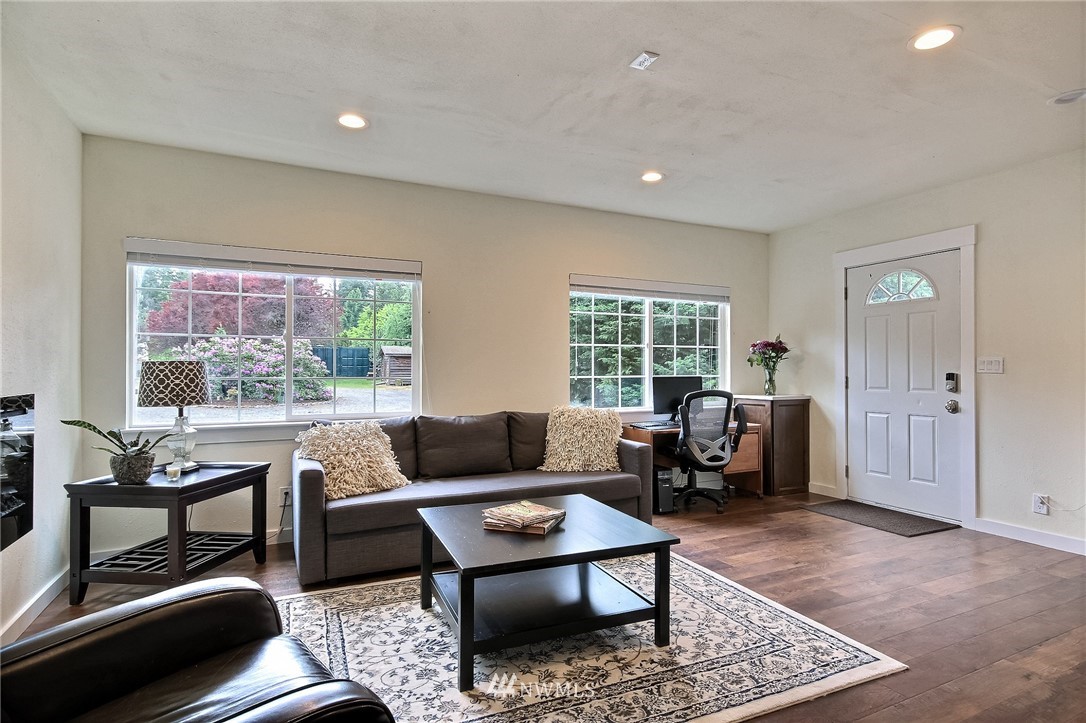 4706 224th Street Southeast Bothell, WA 98021 - Photo 28 of 38 a living room with furniture and a window