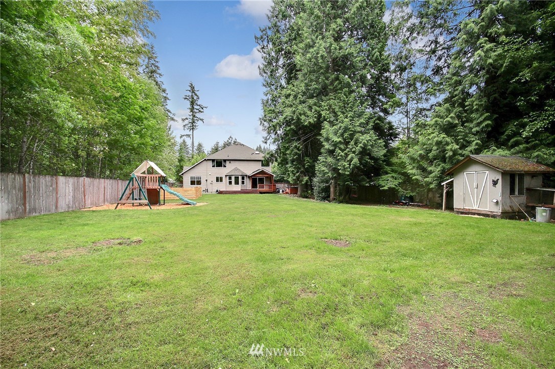 4706 224th Street Southeast Bothell, WA 98021 - Photo 34 of 38 a view of a house with backyard and a tree
