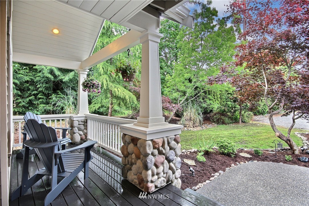 4706 224th Street Southeast Bothell, WA 98021 - Photo 37 of 38 a view of a patio with a table and chairs