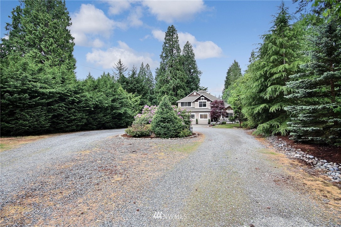 4706 224th Street Southeast Bothell, WA 98021 - Photo 38 of 38 a view of a street with plants and trees