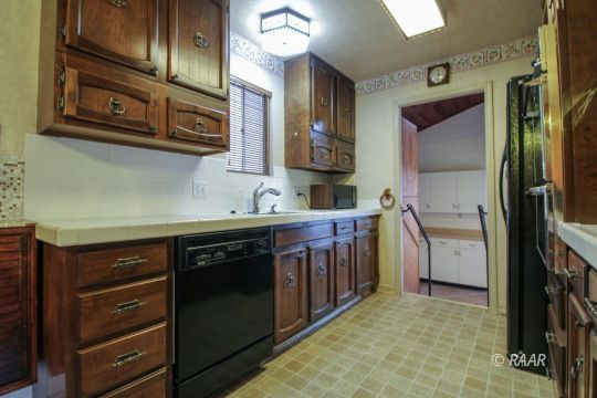 251 West Perdew Avenue Ridgecrest, CA 93555 - Photo 9 of 35 a utility room with a sink a washer and dryer