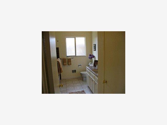 1171 Covington Road Los Altos, CA 94024 - Photo 8 of 9 a picture of a bathroom with a sink and mirror