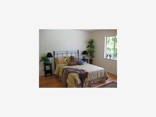 1171 Covington Road Los Altos, CA 94024 - Photo 9 of 9 a bedroom with a bed and a potted plant