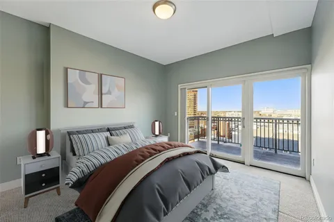 a bedroom with a bed and glass window