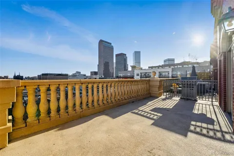 a view of a balcony with city view