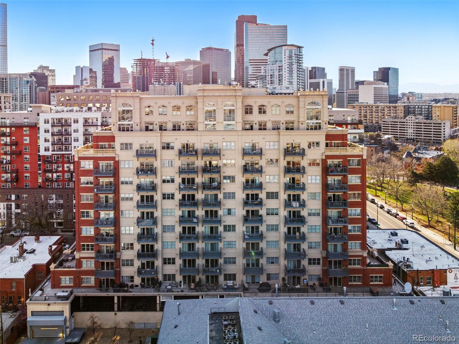 1950 Logan Street, Unit 1109 Denver, CO 80203 - Photo 2 of 49 a view of a city with tall buildings