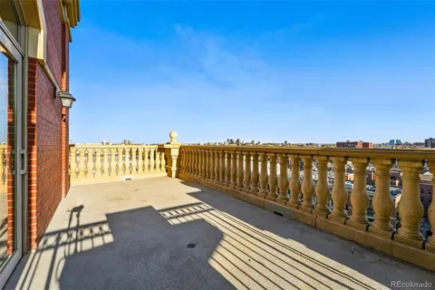 a view of balcony with wooden floor