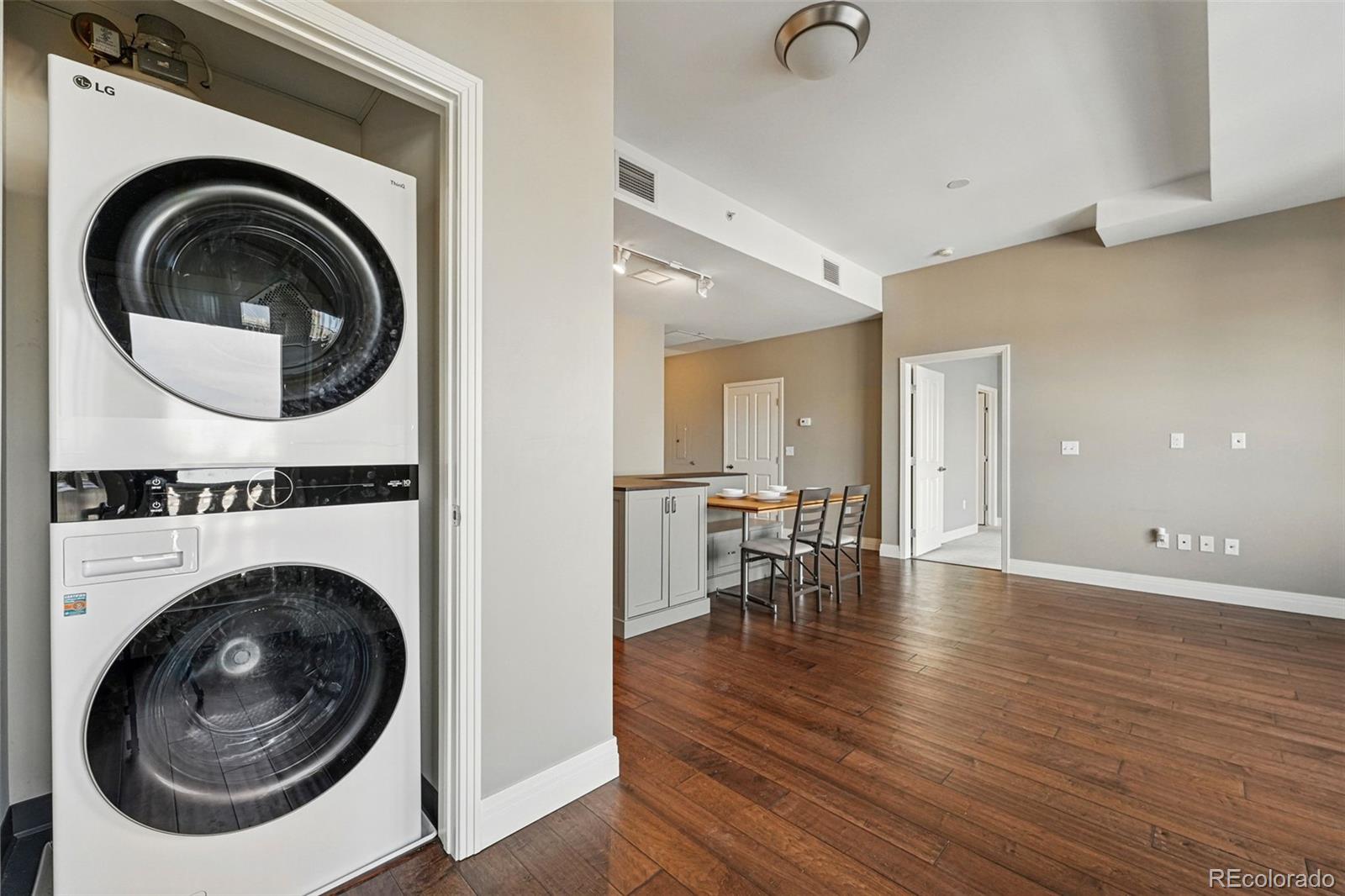 1950 Logan Street, Unit 1109 Denver, CO 80203 - Photo 24 of 49 a view of a hallway with washer and dryer