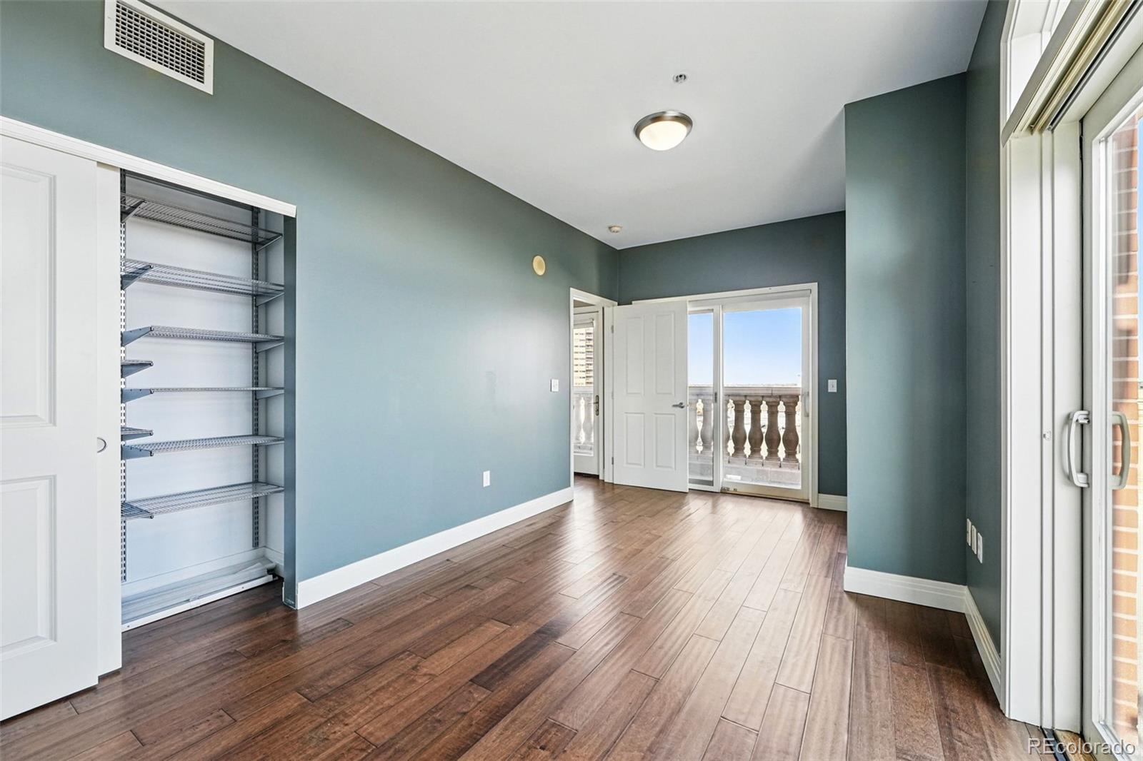 1950 Logan Street, Unit 1109 Denver, CO 80203 - Photo 30 of 49 wooden floor in an empty room with a window