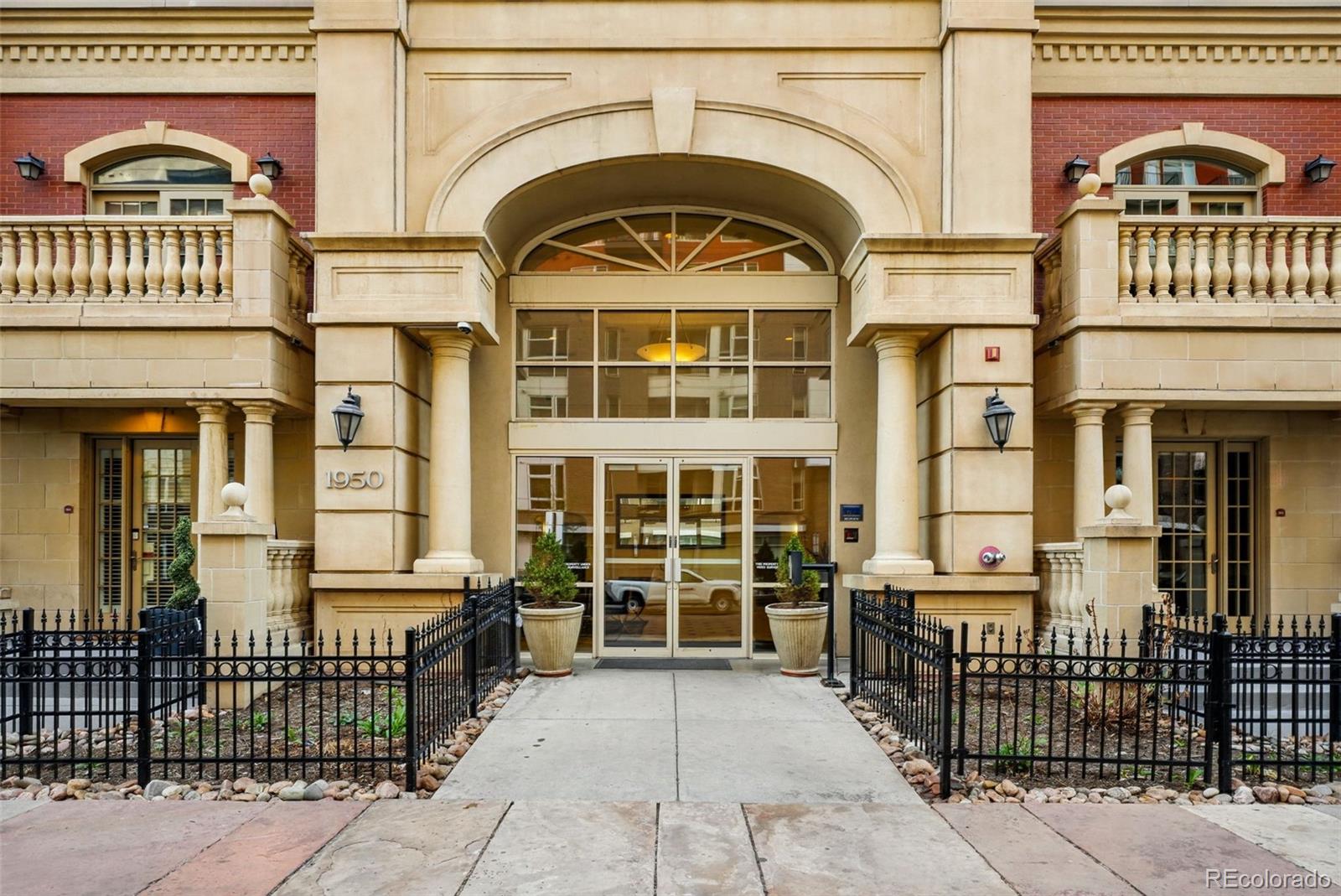 1950 Logan Street, Unit 1109 Denver, CO 80203 - Photo 35 of 49 a view of a large building with a lot of windows