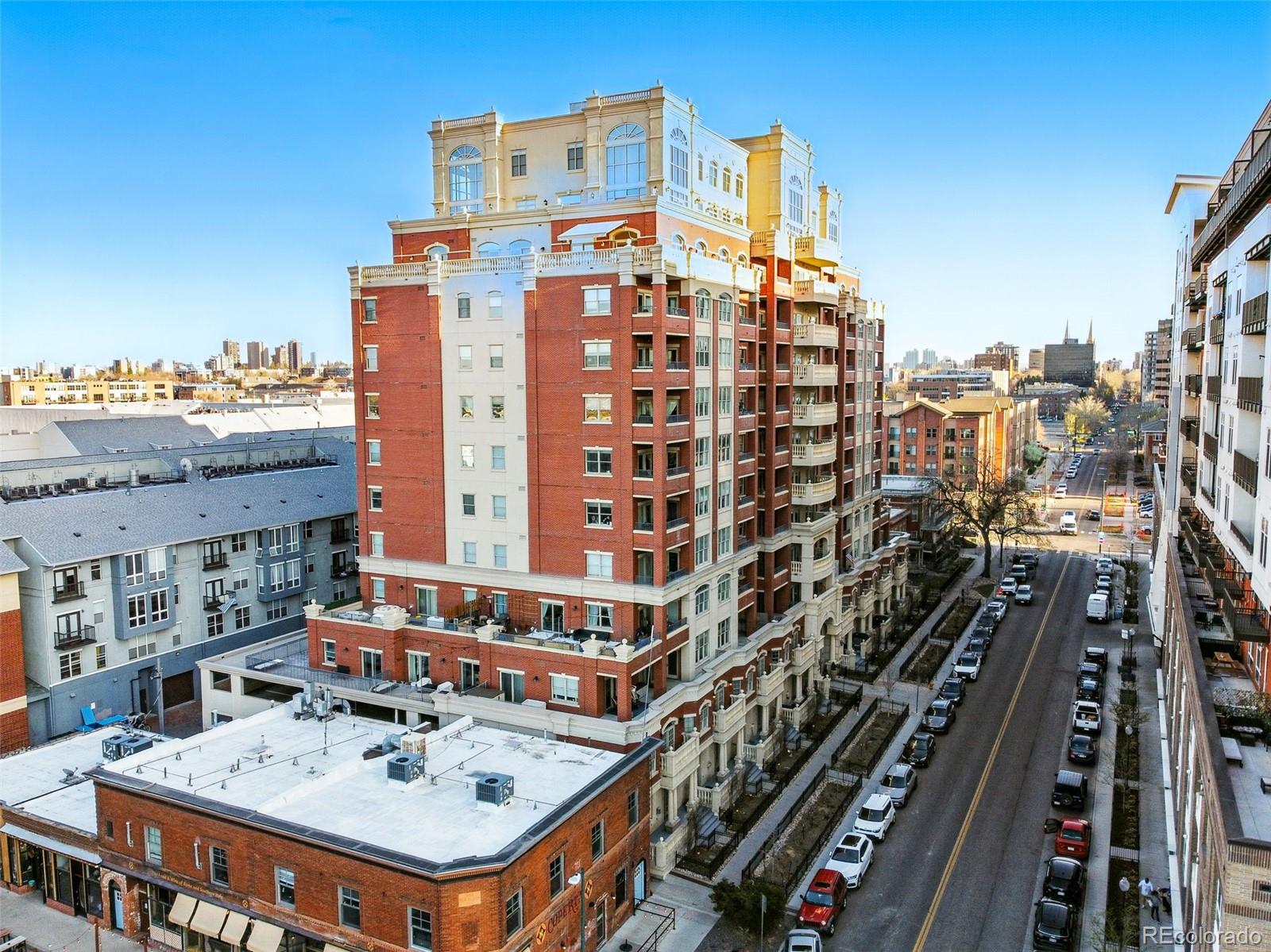 1950 Logan Street, Unit 1109 Denver, CO 80203 - Photo 41 of 49 a large building with a clock on the wall