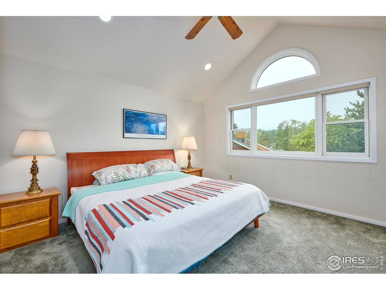 2877 Tincup Circle Boulder, CO 80305 - Photo 17 of 38 a bedroom with a large bed and a window