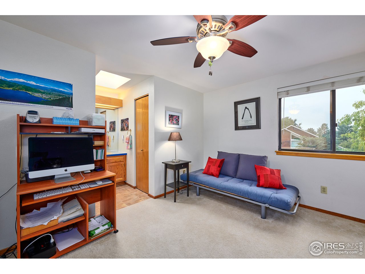 2877 Tincup Circle Boulder, CO 80305 - Photo 21 of 38 a living room with furniture and a flat screen tv