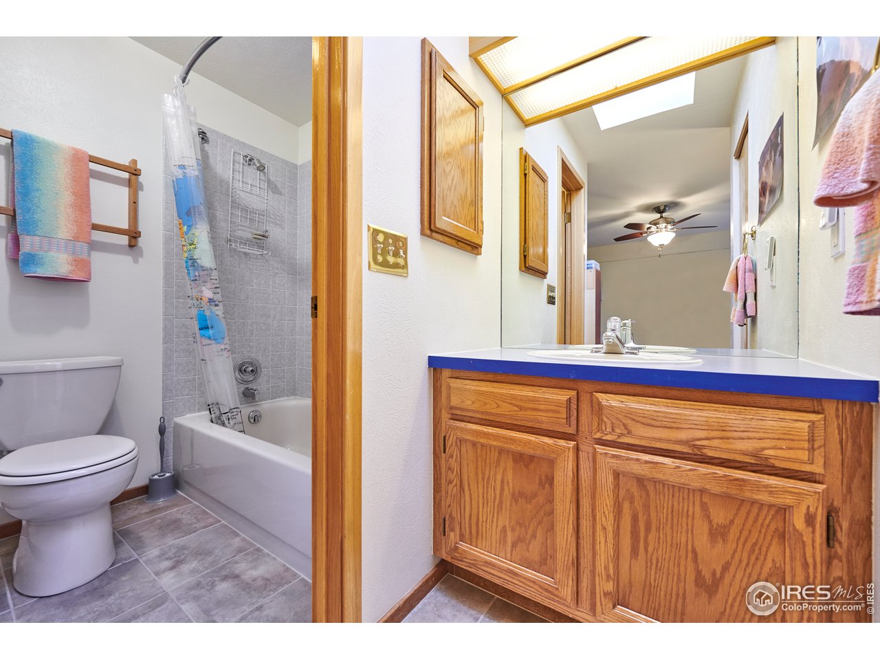 2877 Tincup Circle Boulder, CO 80305 - Photo 22 of 38 a bathroom with a sink a toilet and shower