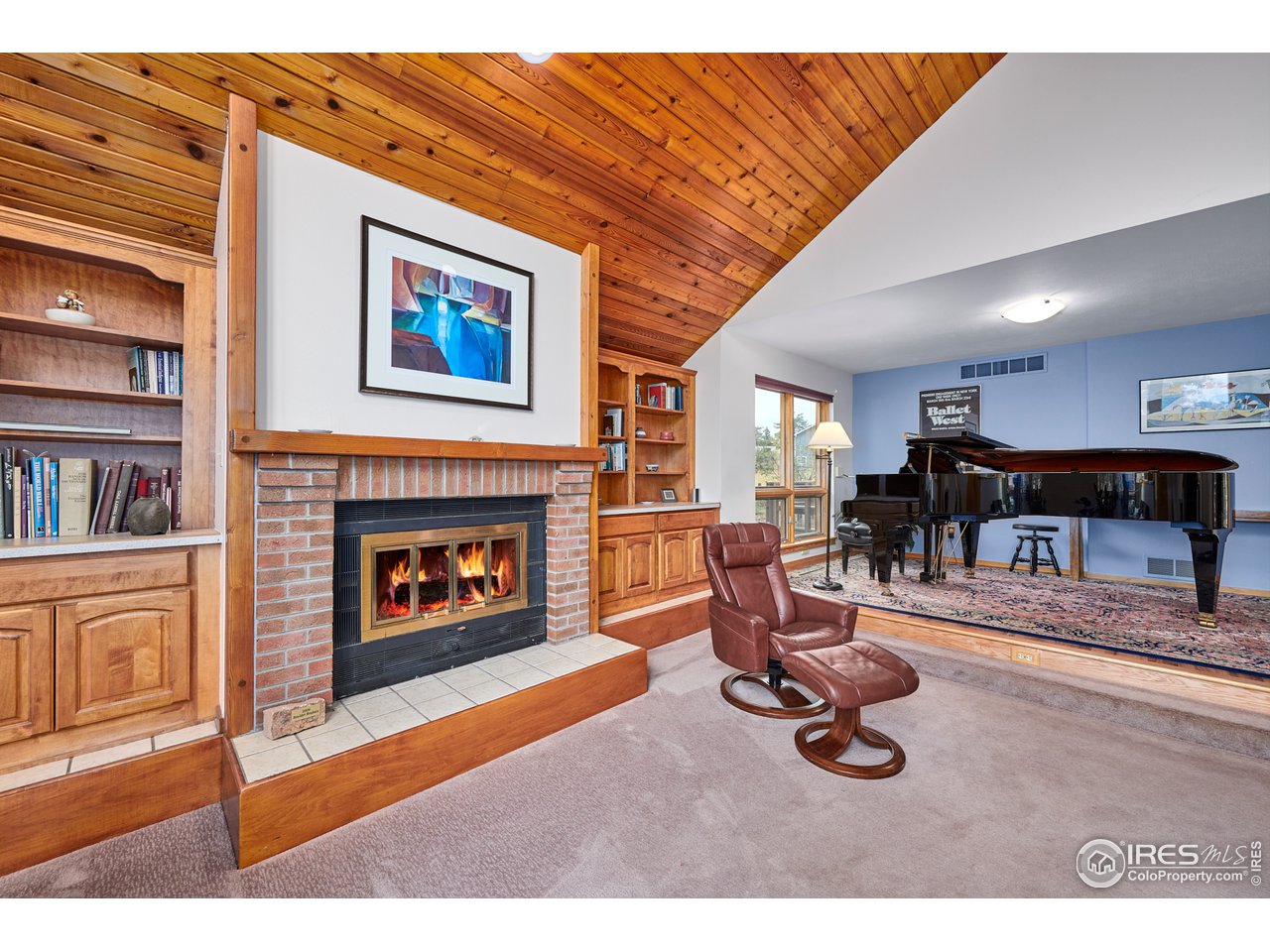 2877 Tincup Circle Boulder, CO 80305 - Photo 8 of 38 a living room with furniture and a fireplace