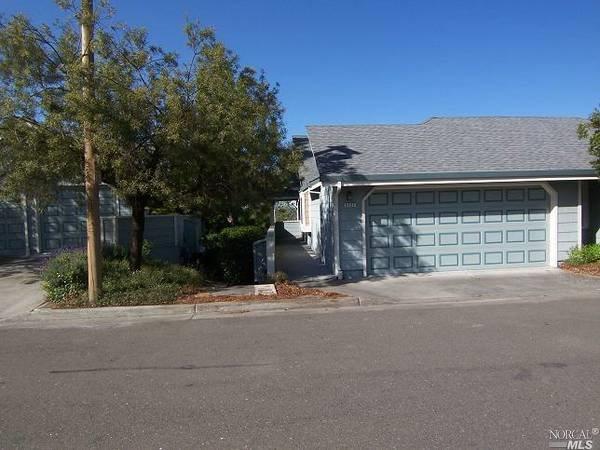 2127 Stonefield Lane Santa Rosa, CA 95403 - Photo 1 of 1 a front view of a house with a yard and garage