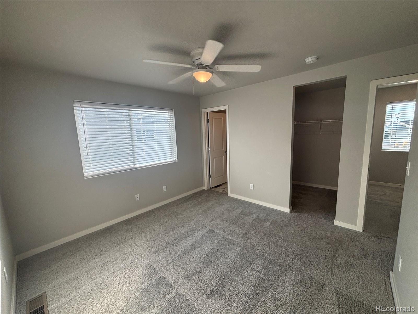 260 Pawnee Road, Unit C1 Ault, CO 80610 - Photo 11 of 14 a view of an empty room with a window