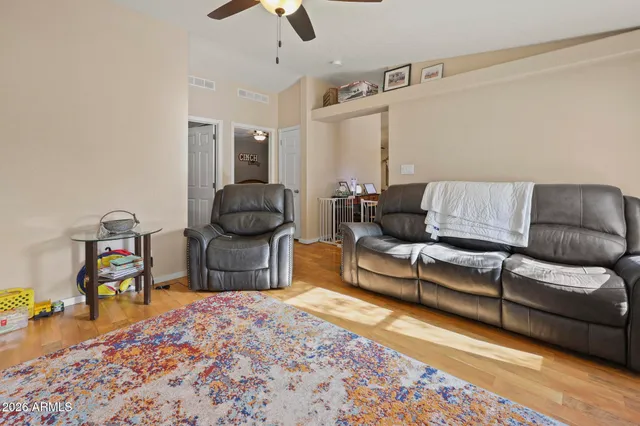 a bedroom with furniture and a rug