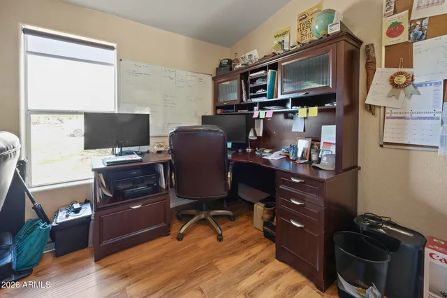 a view of workspace with wooden floor shelves