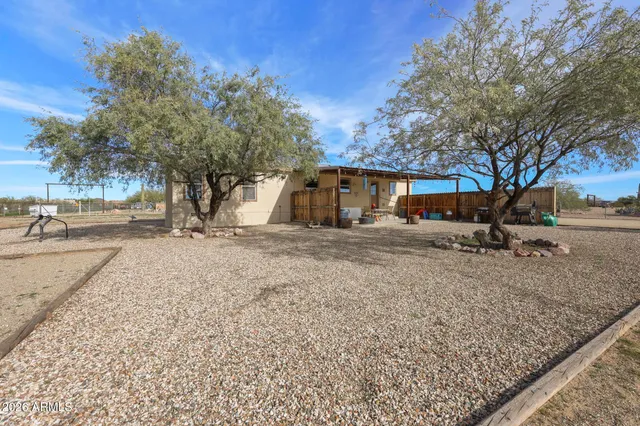 a large house with a large tree and yard
