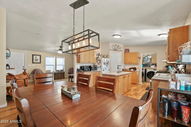 a living room with lots of furniture and a wooden floor