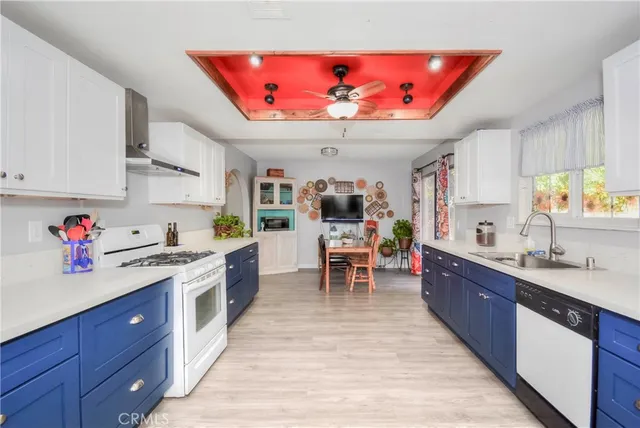 a open kitchen with stainless steel appliances granite countertop a stove and cabinets